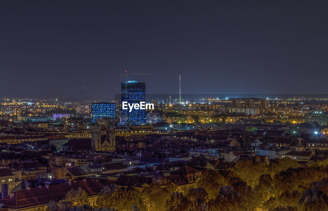 High angle view of city buildings at night