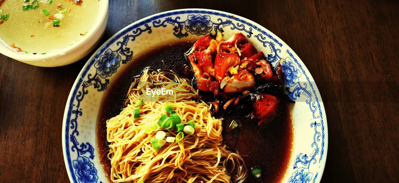 food and drink, food, freshness, healthy eating, wellbeing, table, plate, pasta, indoors, bowl, italian food, noodle, dish, serving size, high angle view, still life, no people, asian food, meal, cuisine, directly above, close-up, garnish, wood, vegetable, produce, meat