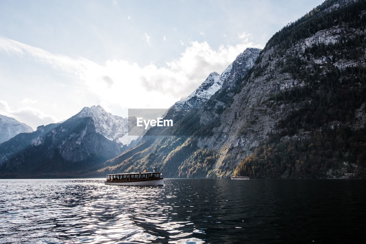 Scenic view of lake königssee with mountains against sky.