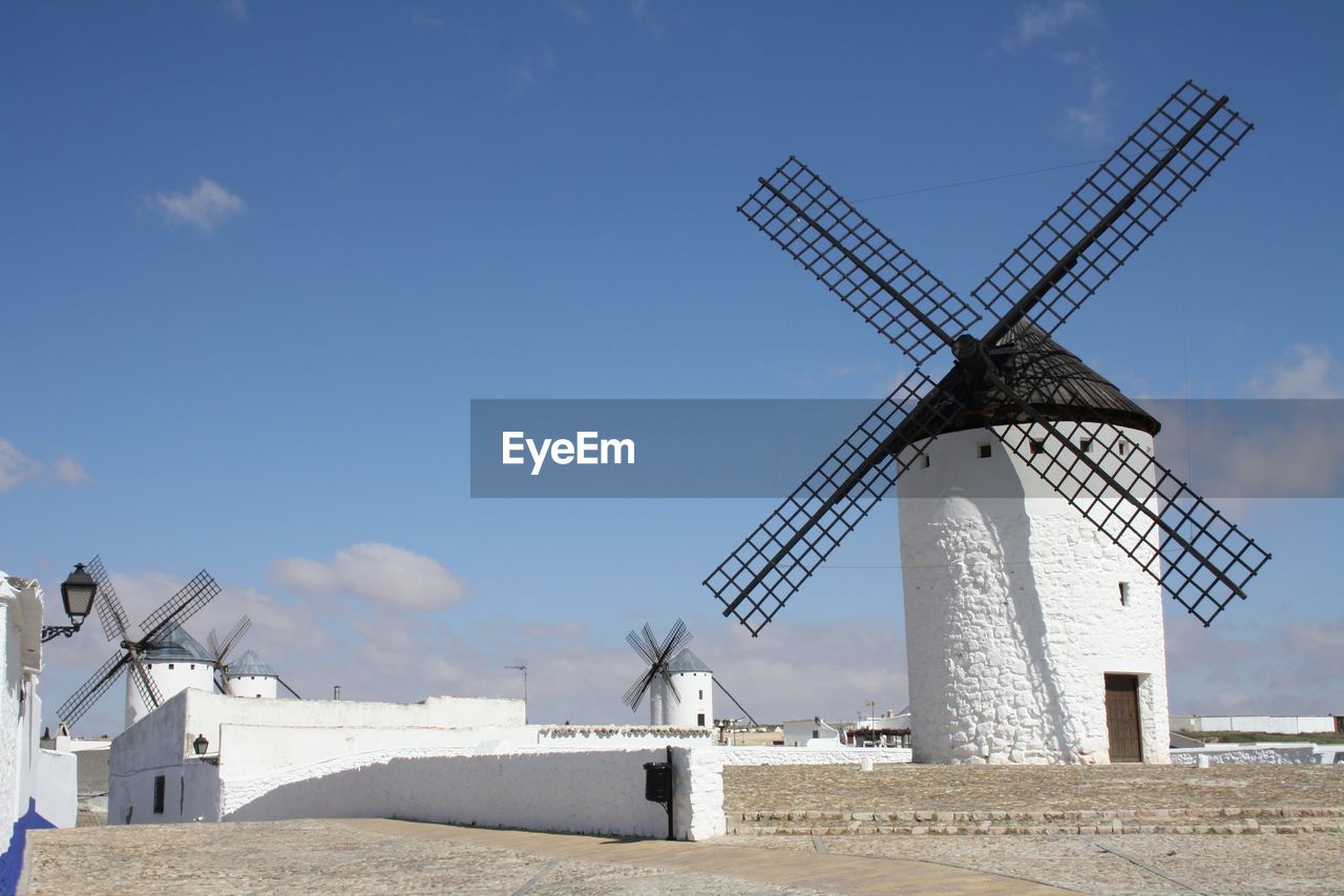 Traditional windmill against sky