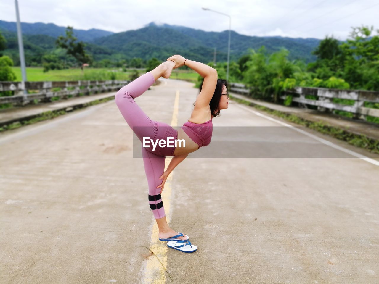 Woman exercising on road