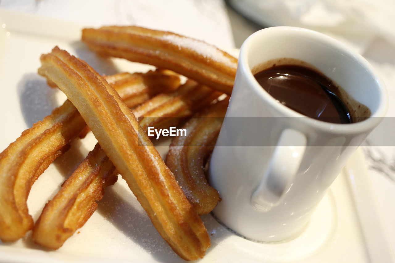 Churros with hot chocolate, a specialty of spanish pastry 