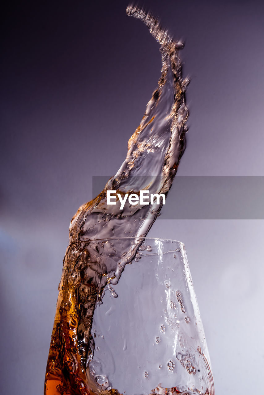 CLOSE-UP OF ICE CRYSTALS AGAINST BLUE BACKGROUND