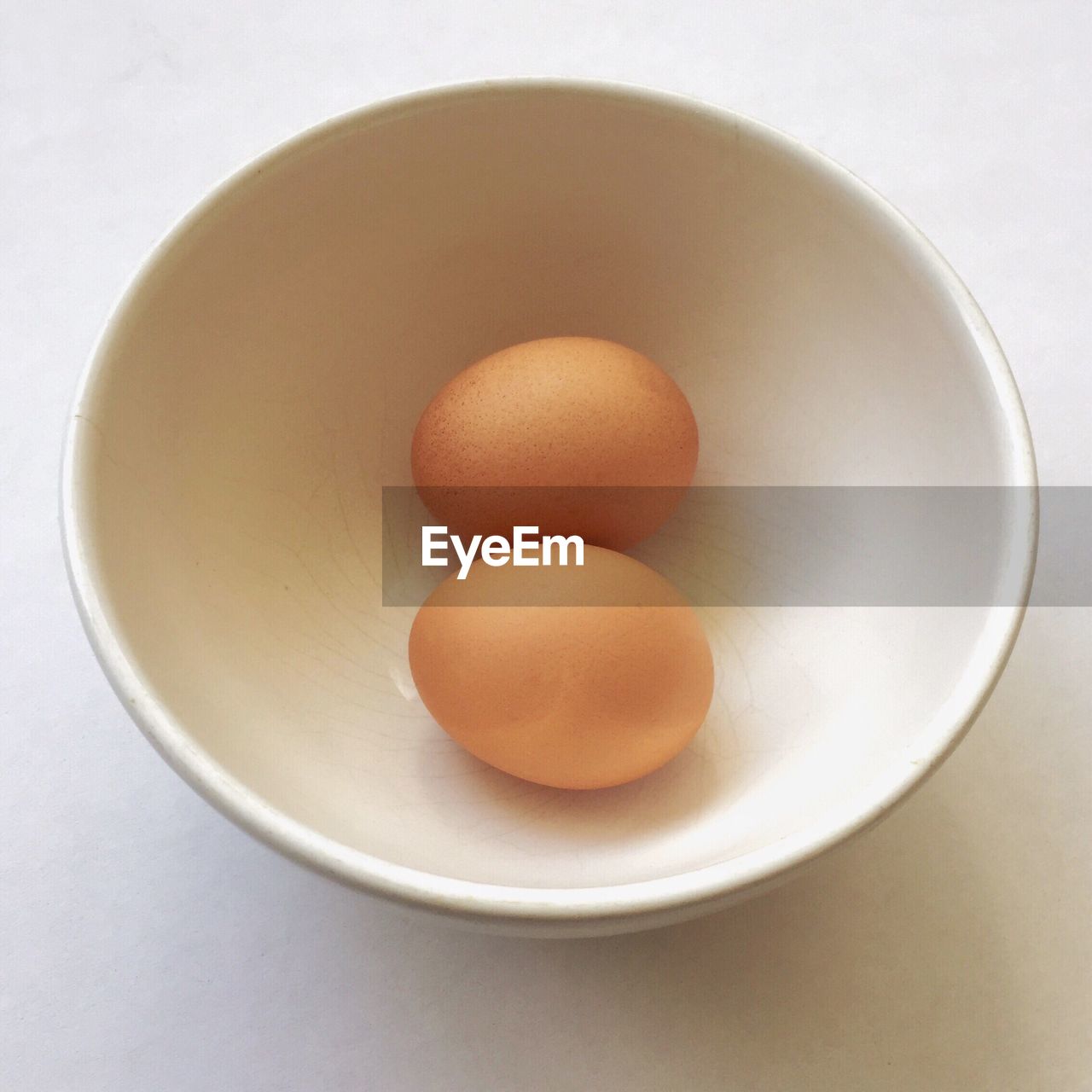 High angle view of eggs in bowl on table