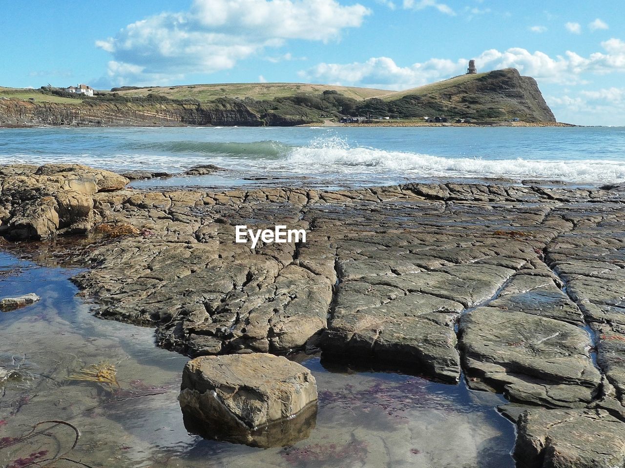 water, shore, rock, sea, coast, sky, land, ocean, nature, scenics - nature, beach, beauty in nature, body of water, cloud, bay, terrain, cove, tranquility, cliff, environment, day, geology, no people, travel destinations, tranquil scene, landscape, mountain, outdoors, travel, wave, coastline, blue, non-urban scene, sand, tourism