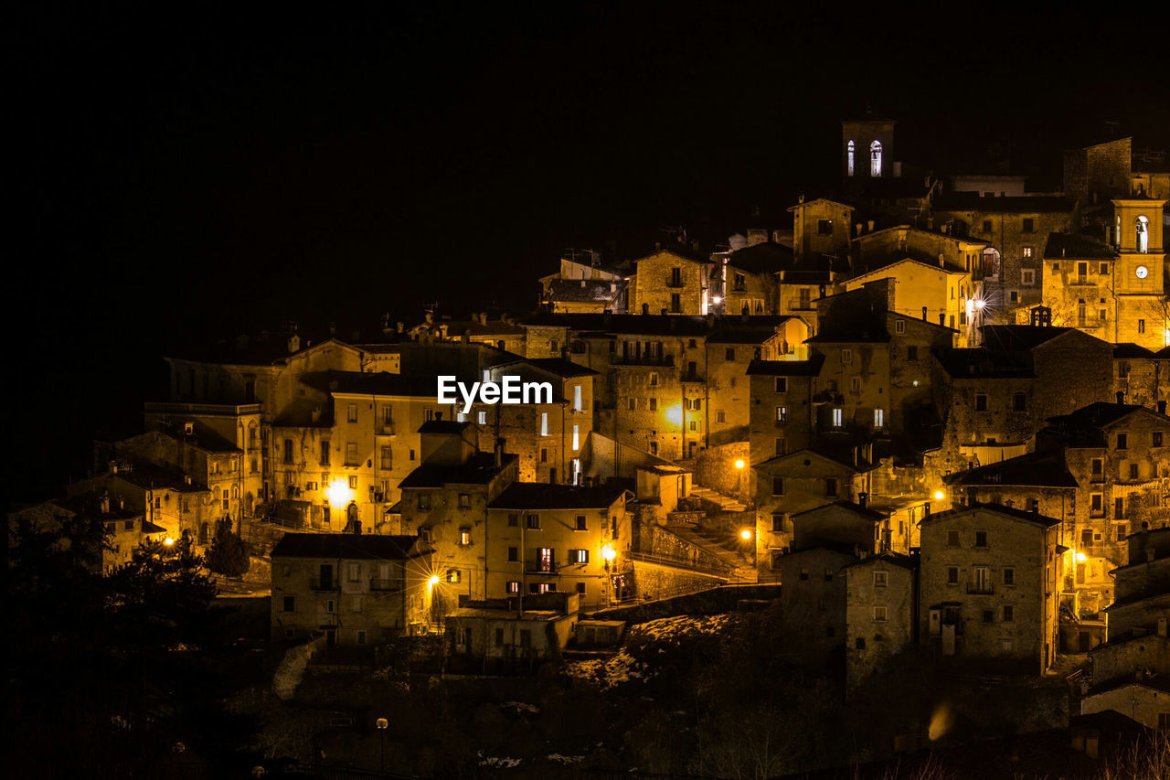 Buildings in city at night