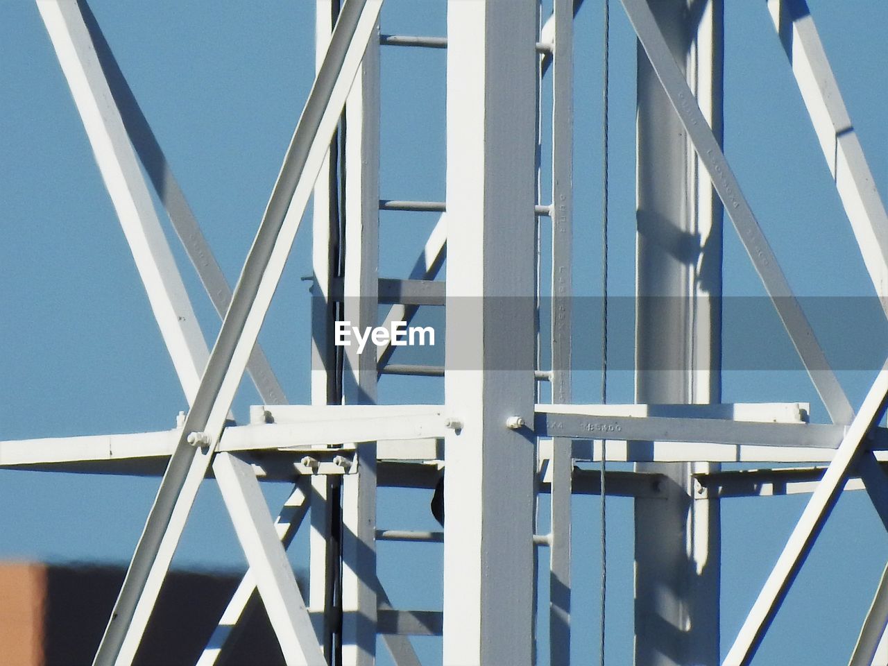 Low angle view of bridge against clear blue sky