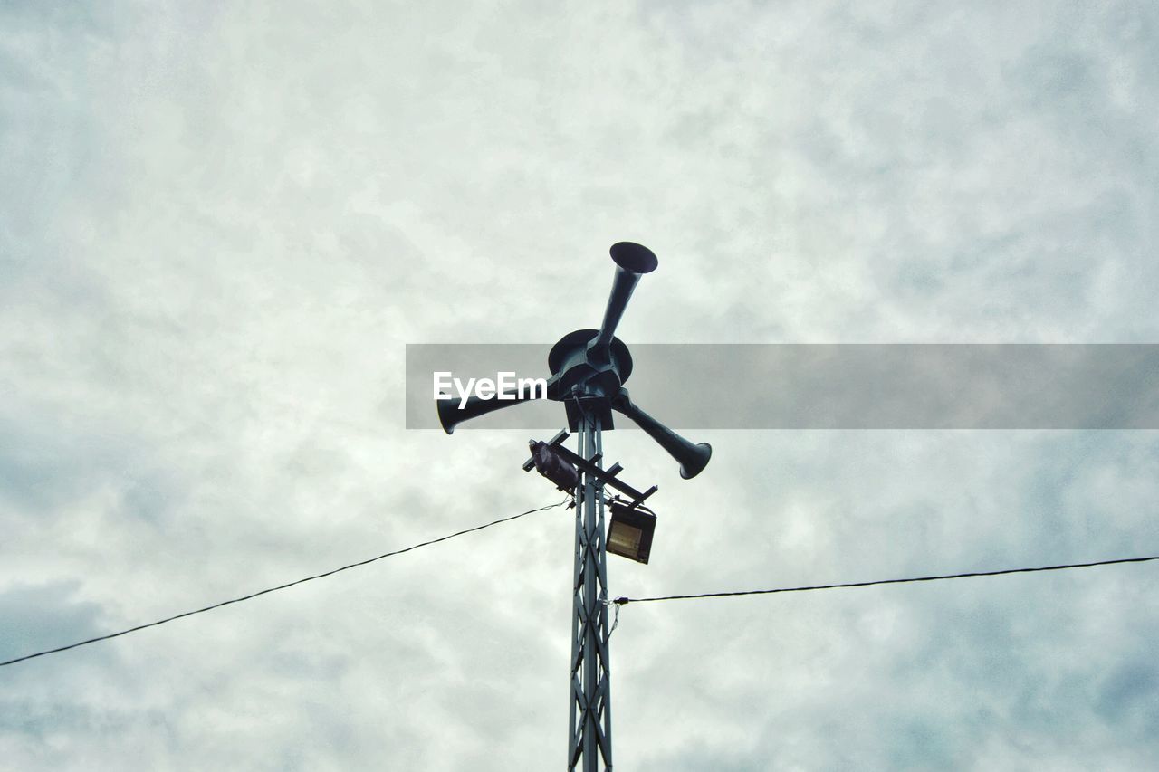 LOW ANGLE VIEW OF TELEPHONE AGAINST SKY