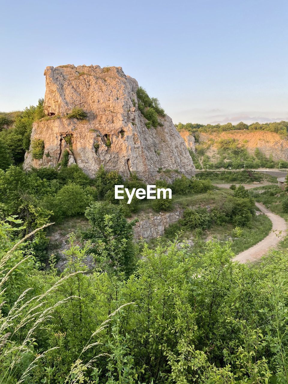 Rock formations on landscape against clear sky