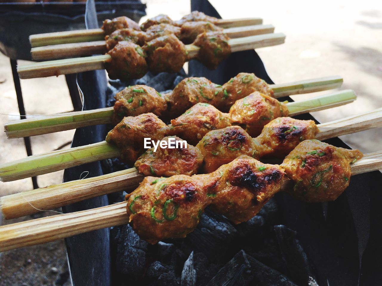 CLOSE-UP OF SEAFOOD ON BARBECUE GRILL