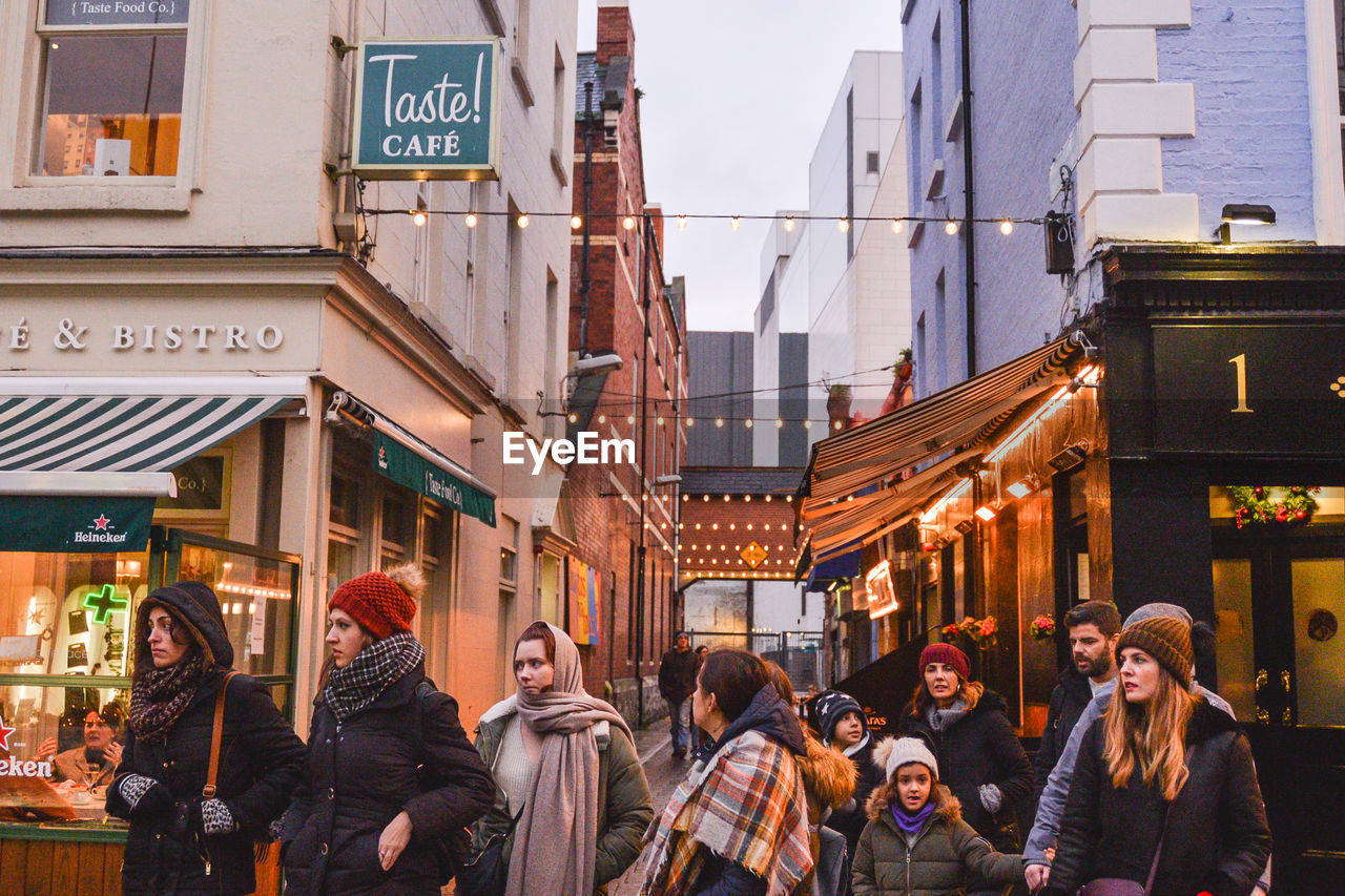 GROUP OF PEOPLE ON CITY STREET