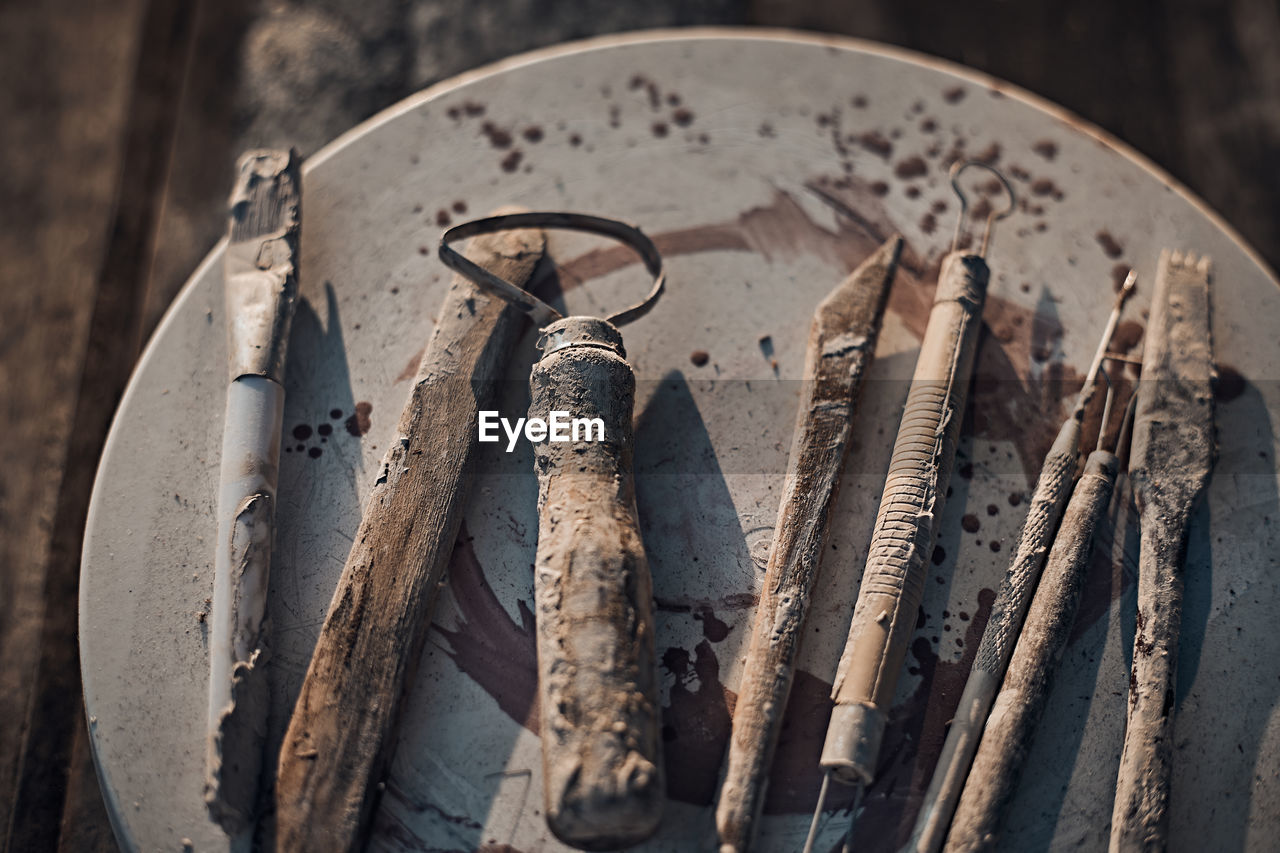 High angle view of metallic tools on table