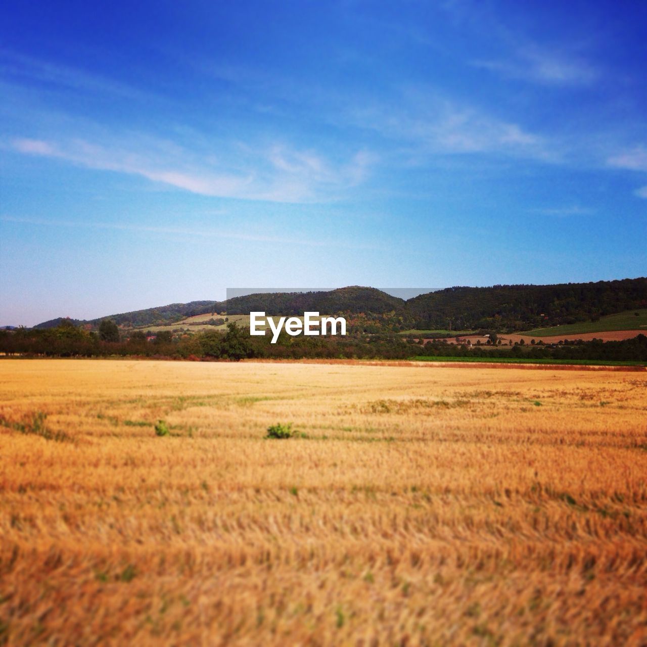 View of countryside landscape against mountain range