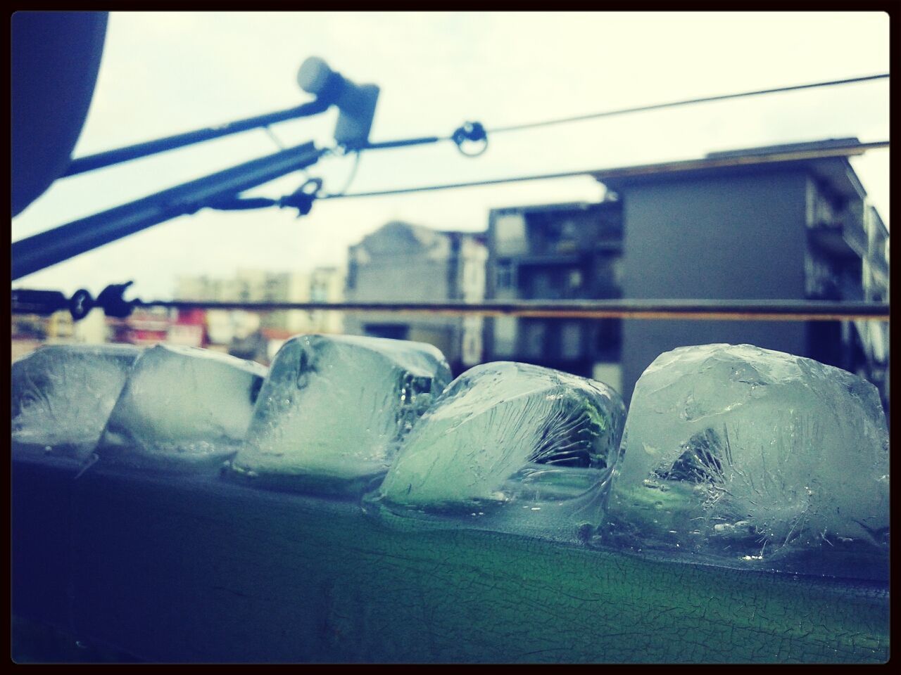 Row of melting ice cubes on wall