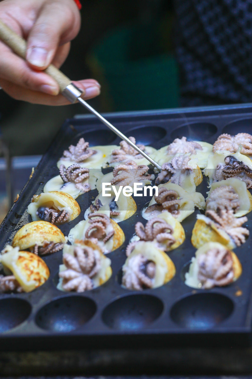 Takoyaki being prepared in ho thi ky street food, ho chi minh city