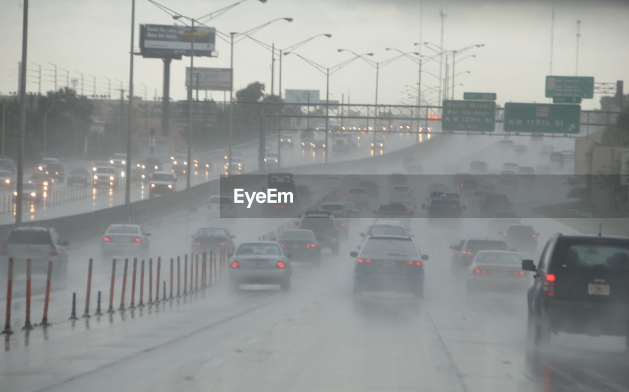 Cars moving on highway during heavy rain
