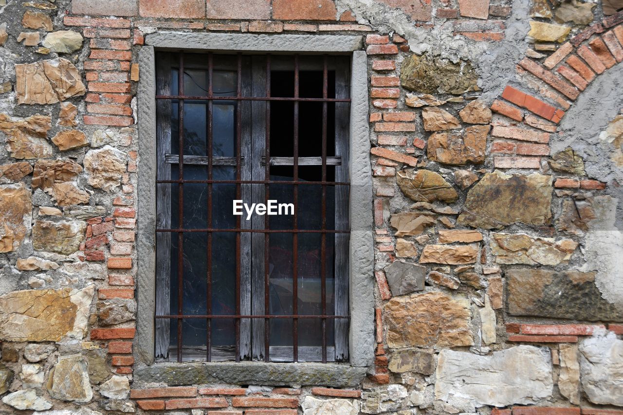 WINDOW ON OLD BUILDING