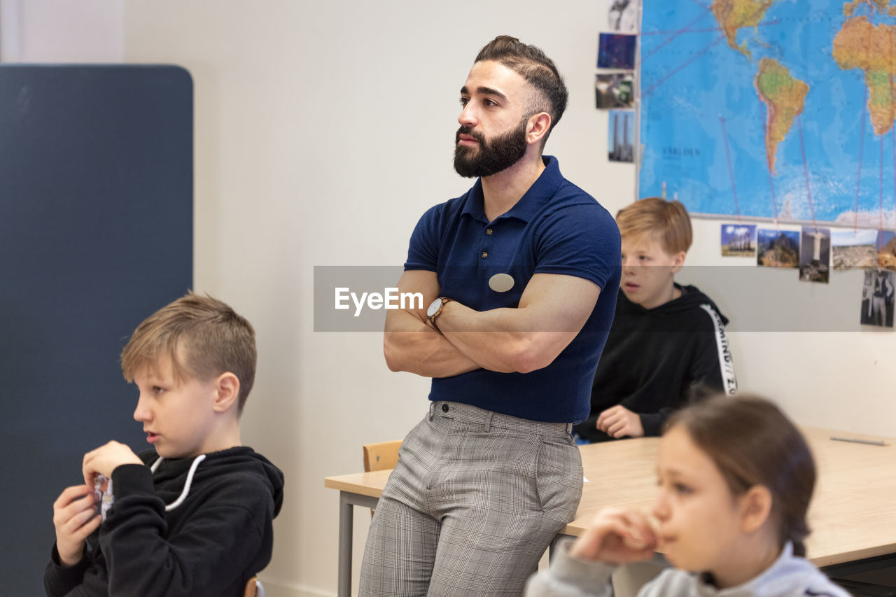 Teacher and schoolchildren in classroom