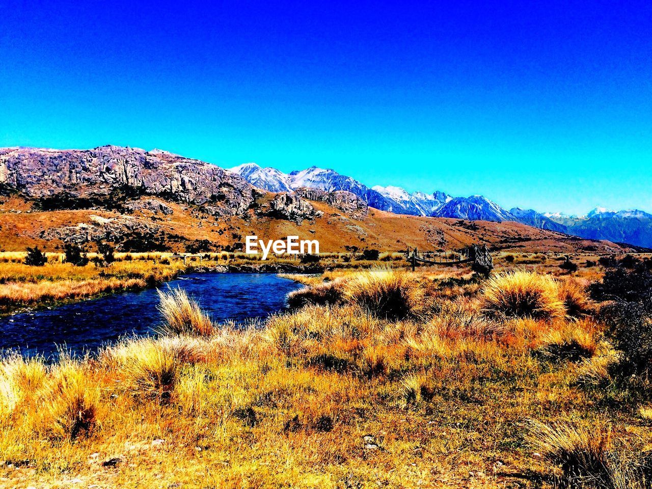 LANDSCAPE WITH MOUNTAIN IN BACKGROUND