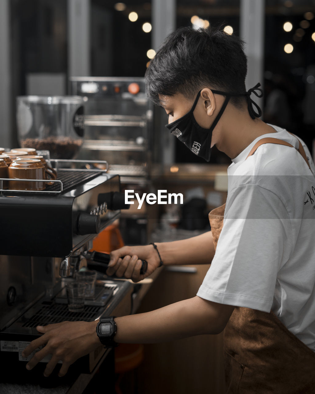 Side view of woman working at restaurant