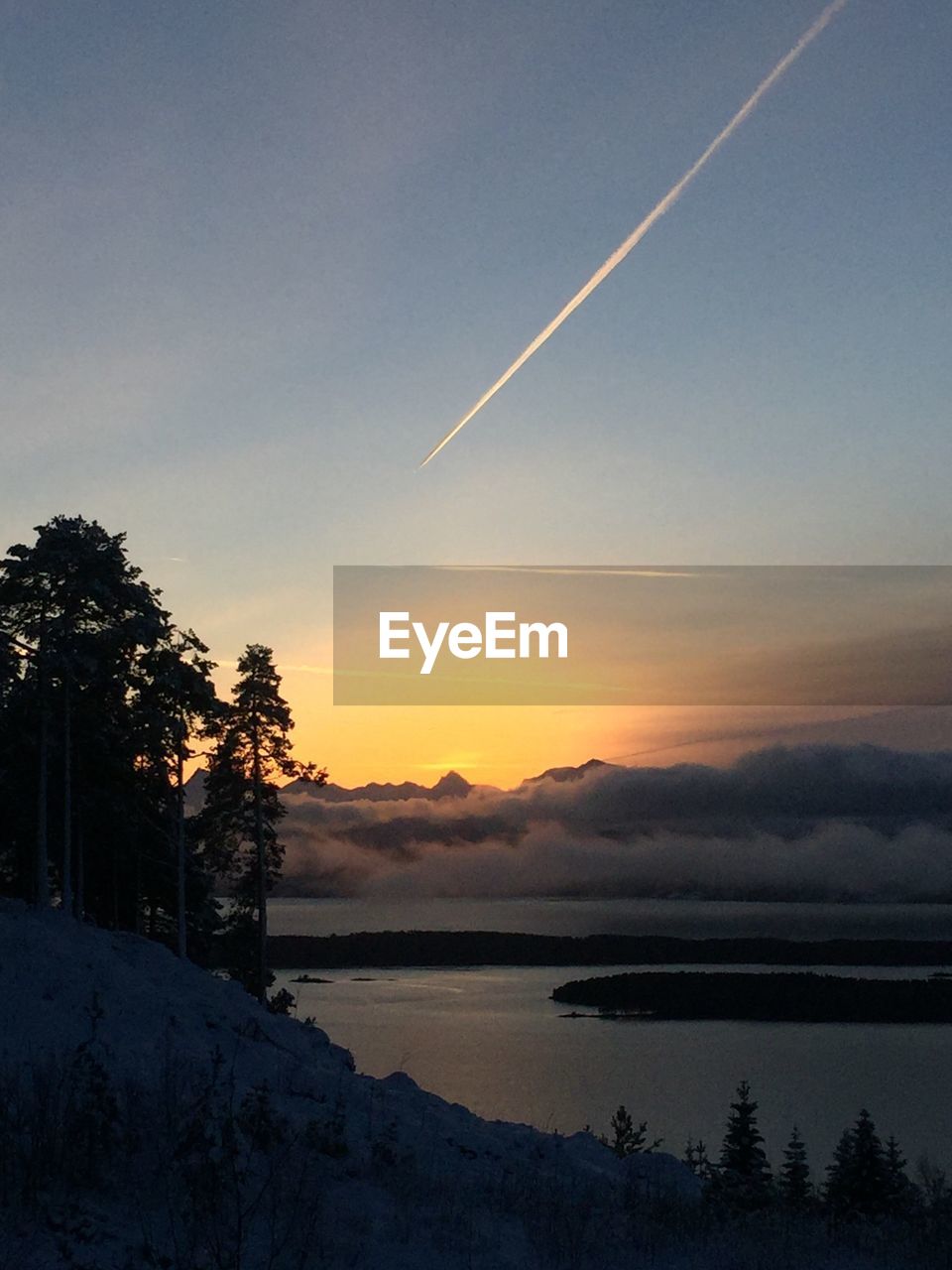 SCENIC VIEW OF SUNSET OVER LAKE