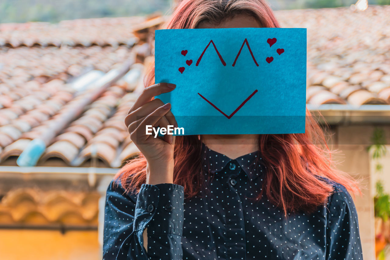 PORTRAIT OF A WOMAN WITH TEXT IN THE BACKGROUND
