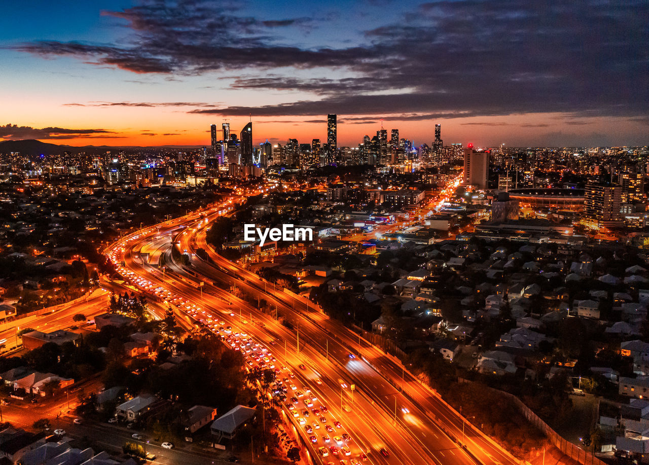 High angle view of illuminated city buildings at night