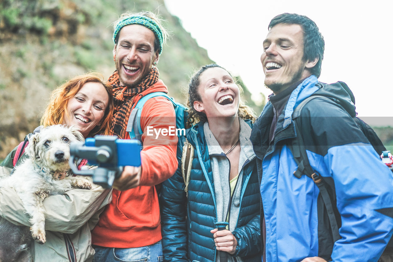 Cheerful hikers taking selfie