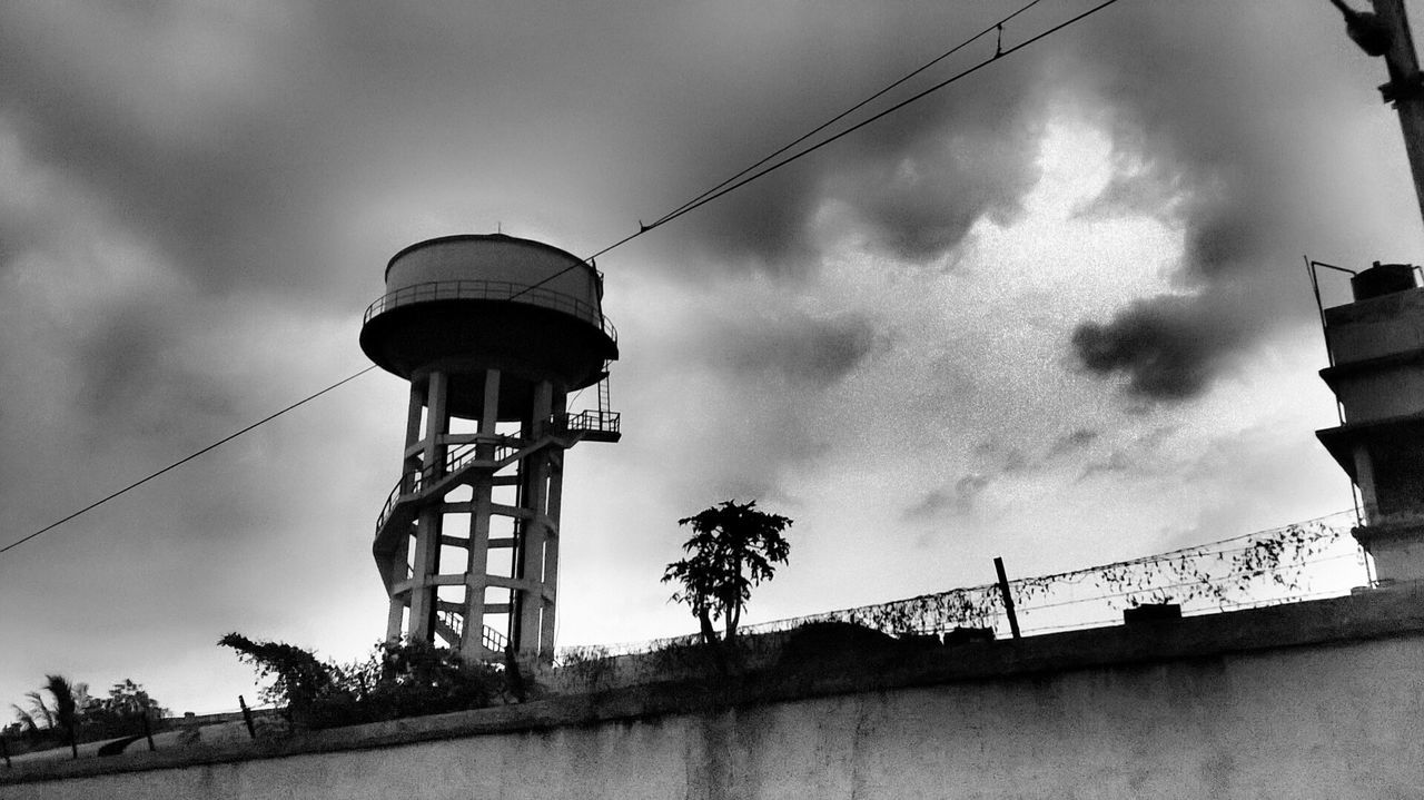 LOW ANGLE VIEW OF TOWER AGAINST CLOUDY SKY