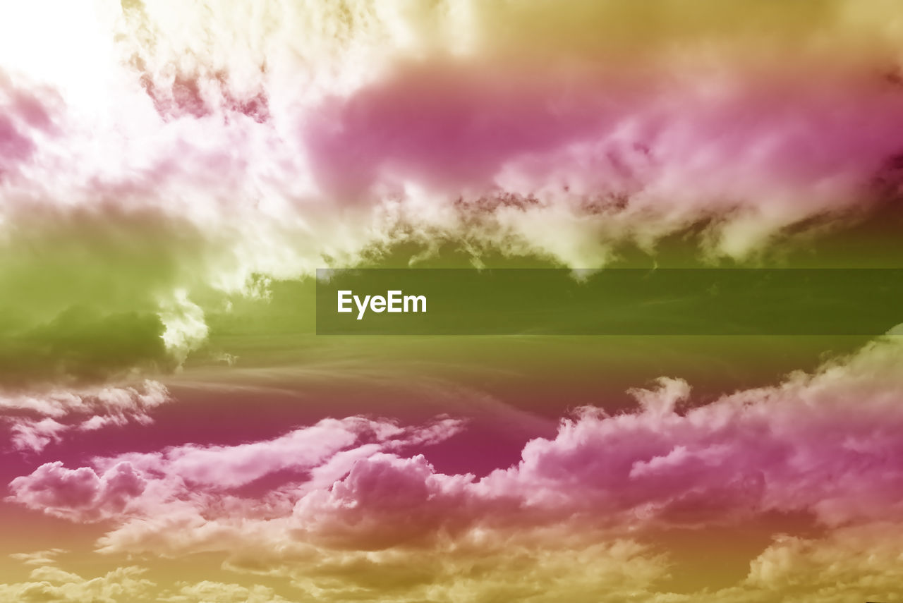 CLOSE-UP OF MULTI COLORED CLOUD AGAINST SKY