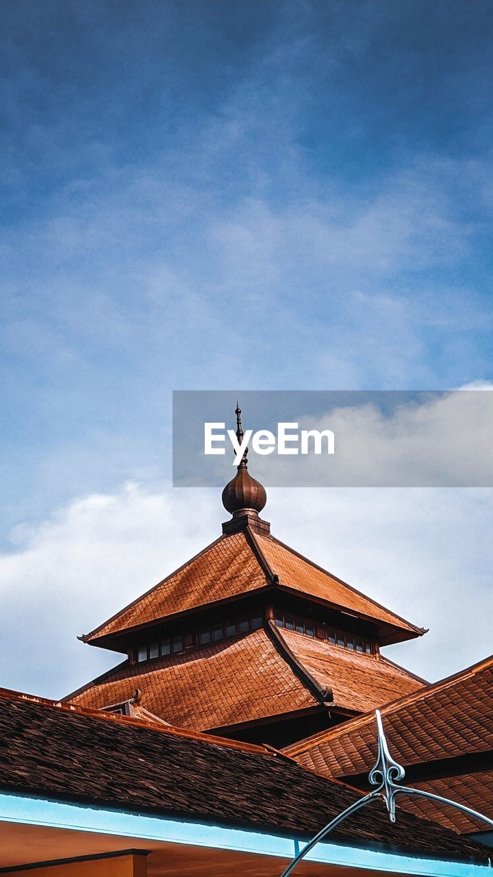 Low angle view of traditional building against sky