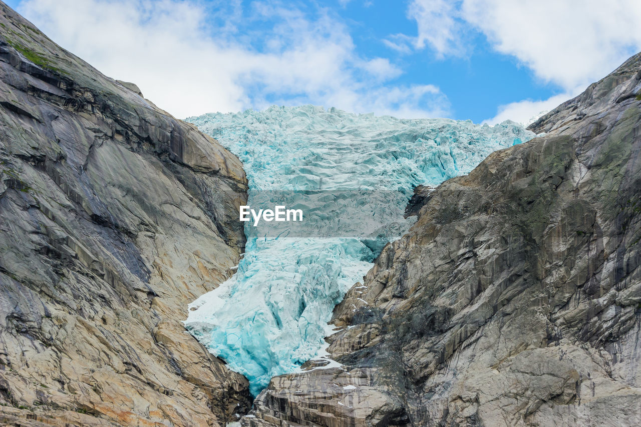panoramic view of rocky mountains against sky