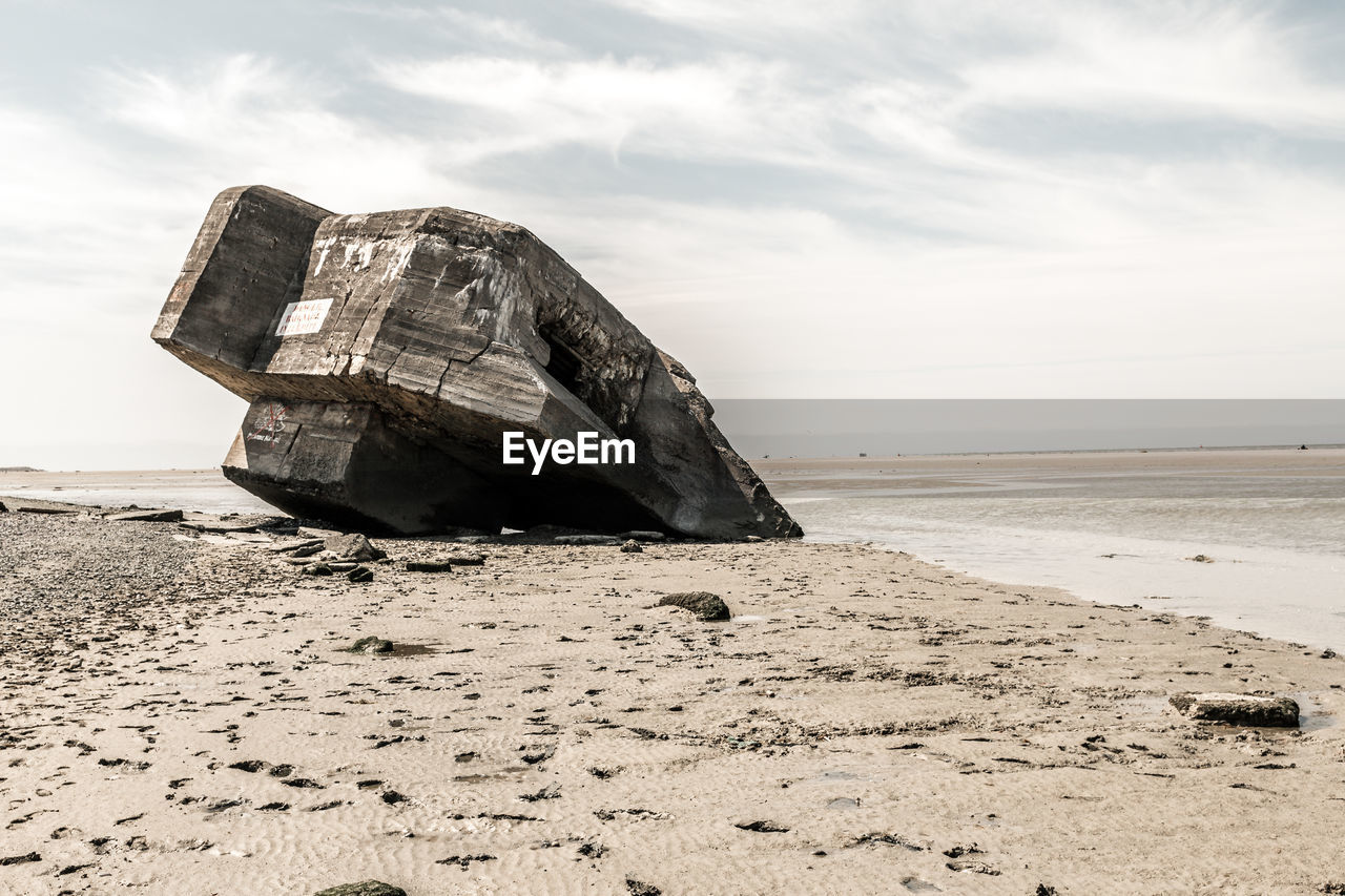 ABANDONED BOAT ON BEACH