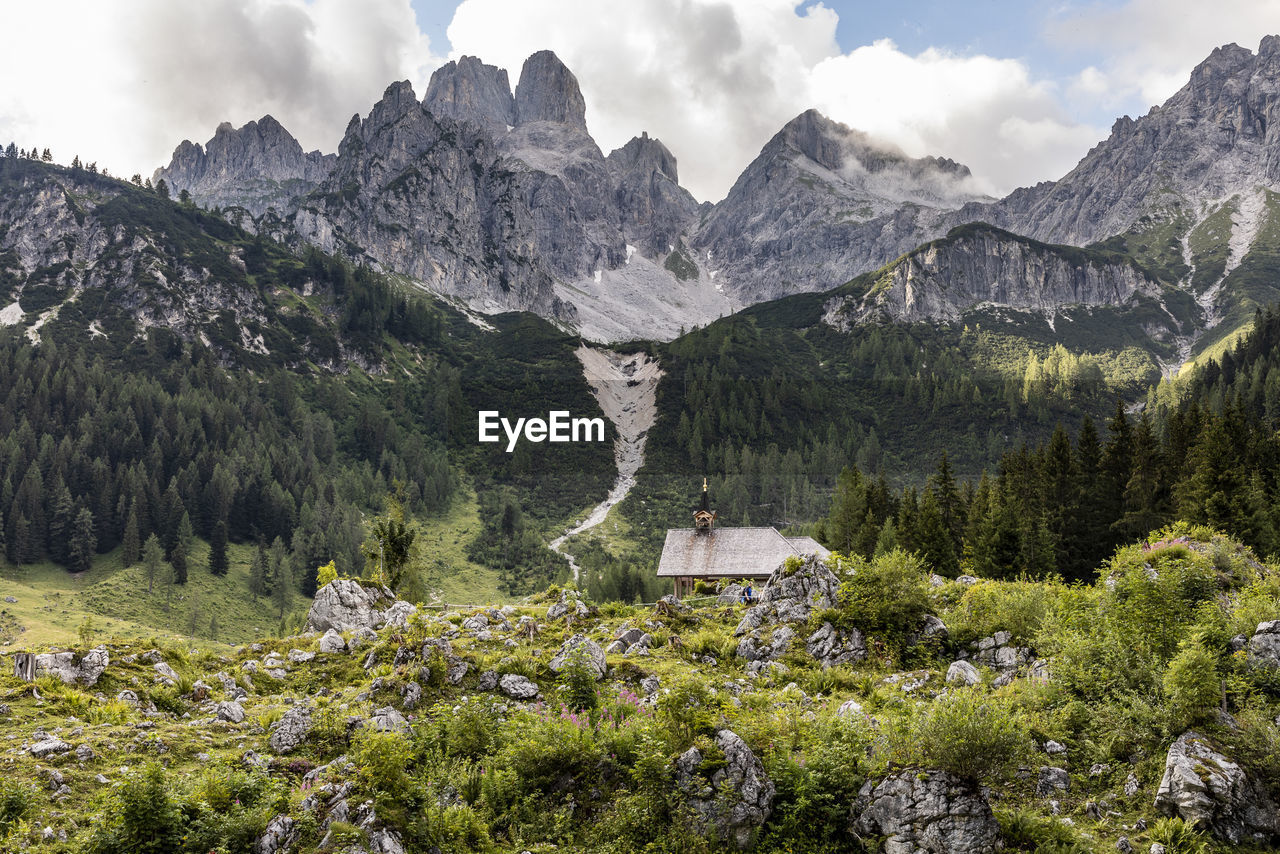 Scenic view of valley amidst mountain against sky