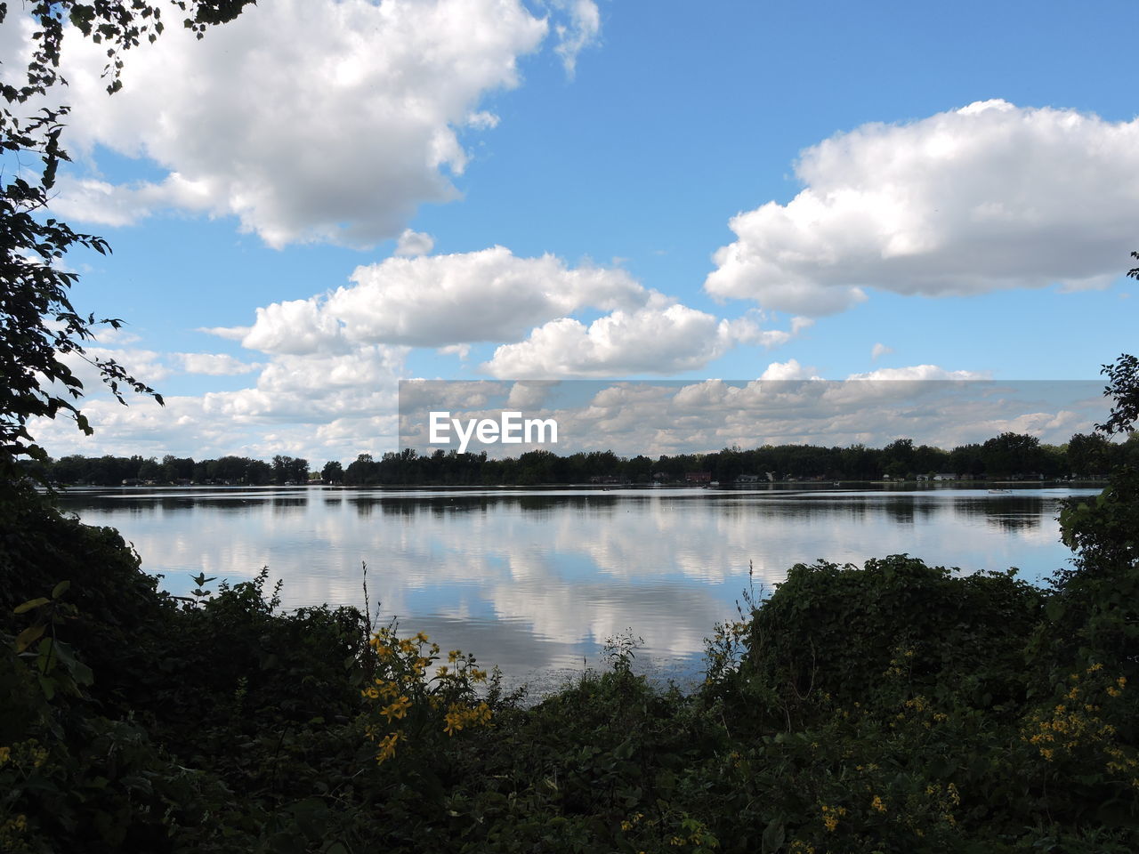 Reflection of sky on calm lake