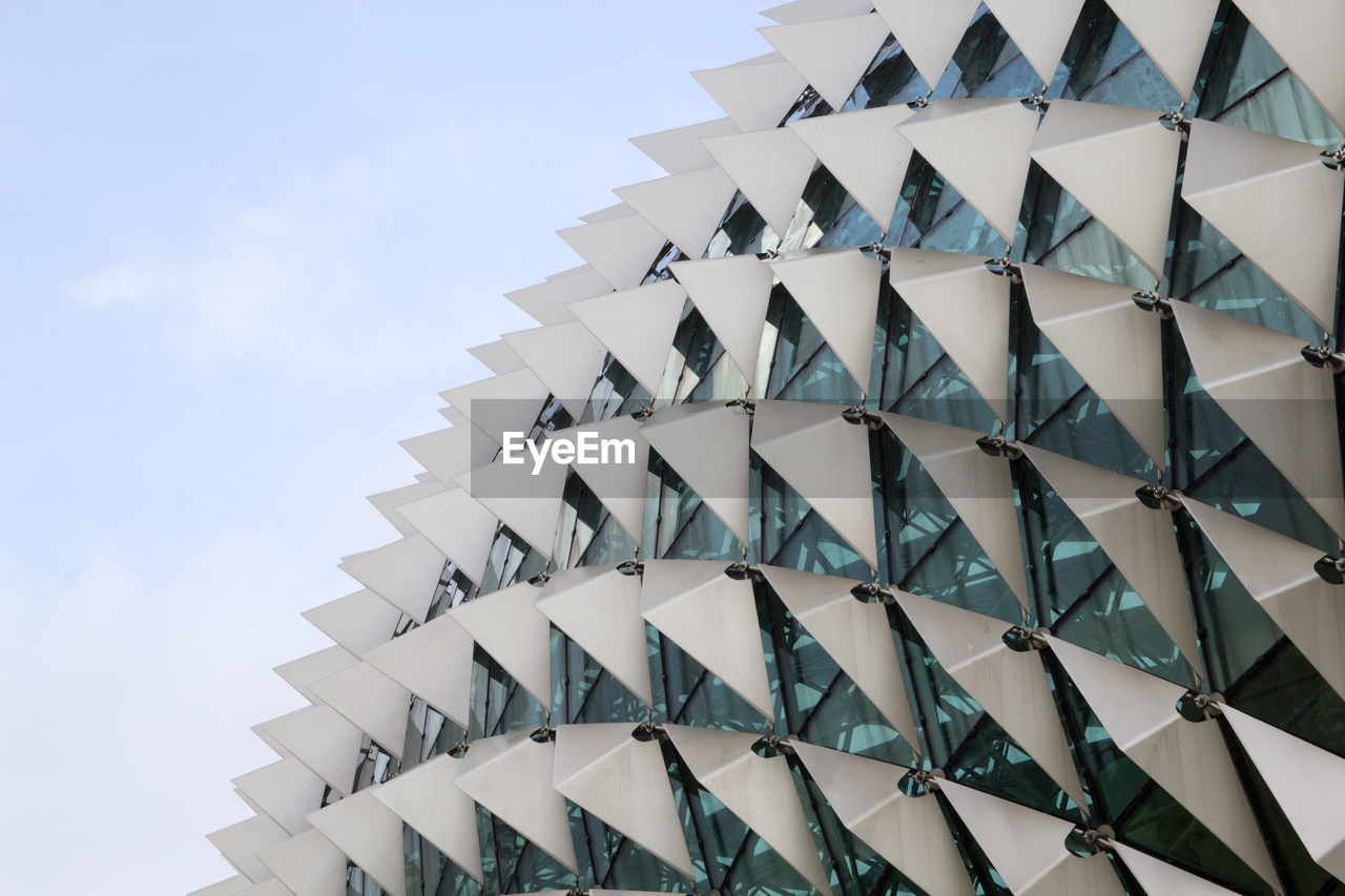 Low angle view of building roof against sky