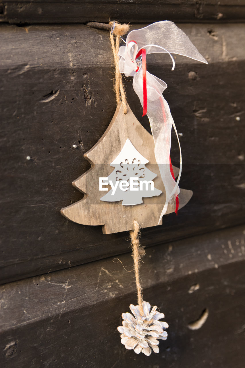 CLOSE-UP OF TIED UP HANGING ON WALL