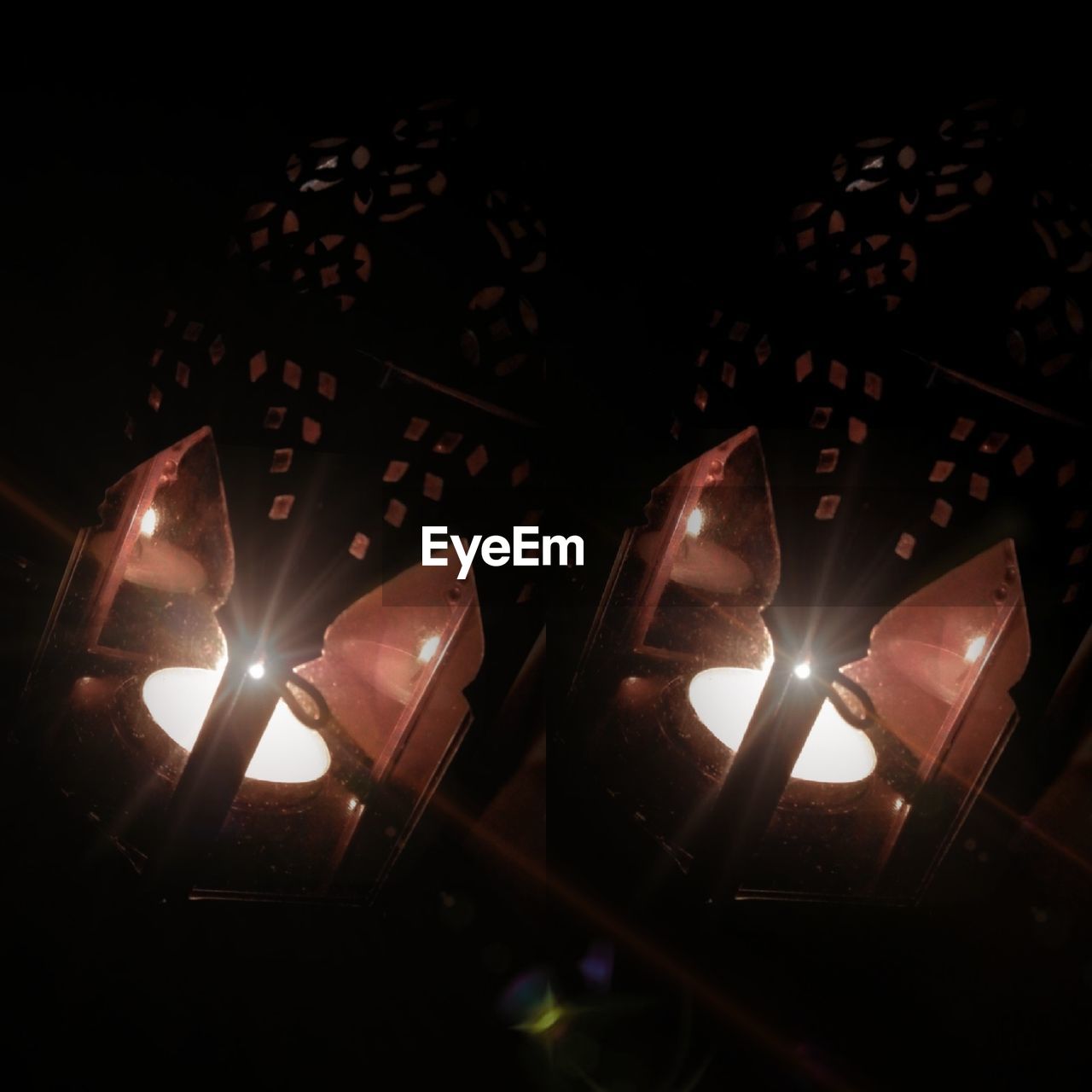 LOW ANGLE VIEW OF ILLUMINATED LIGHTS AT NIGHT