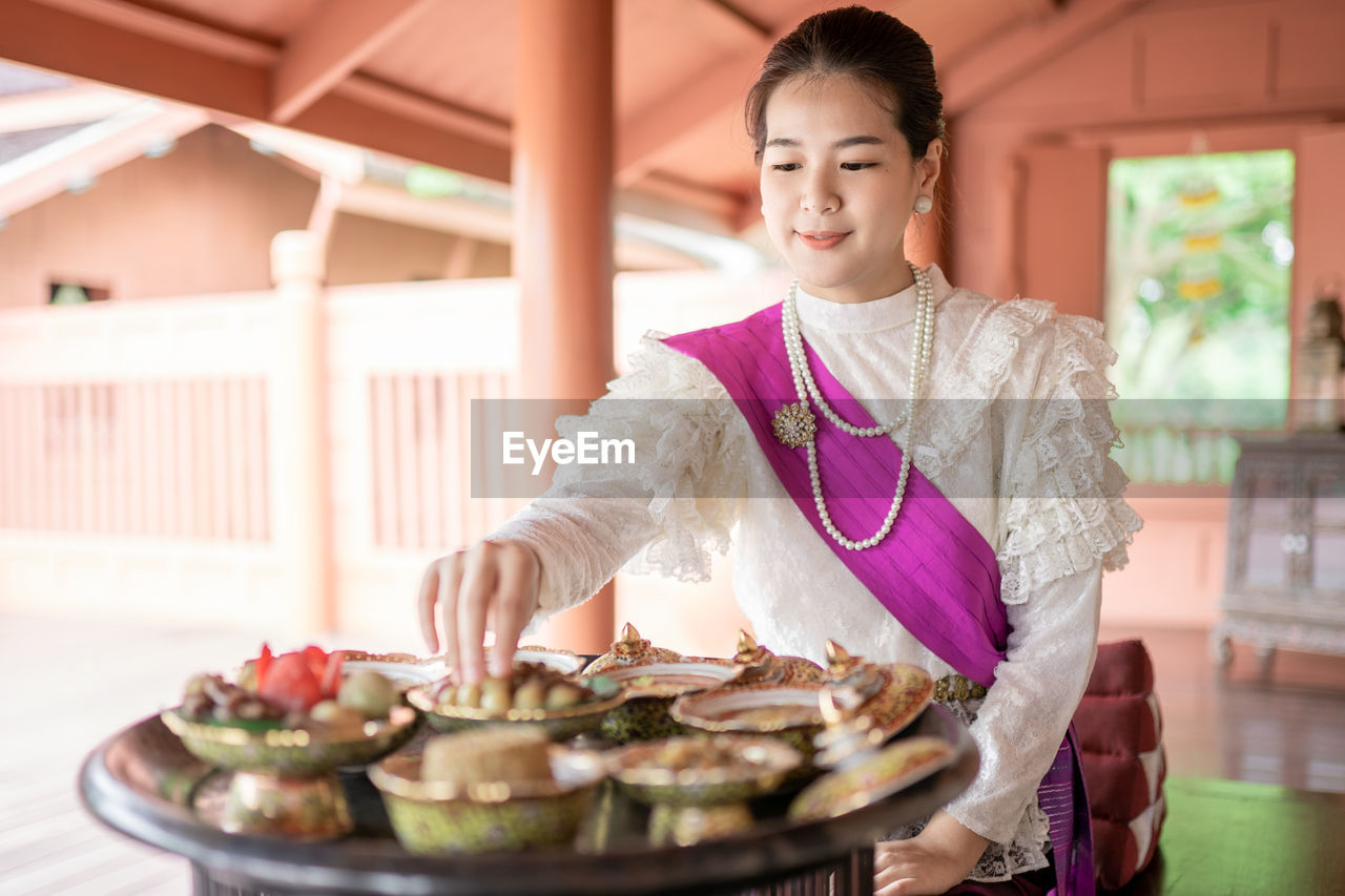 Young woman having food