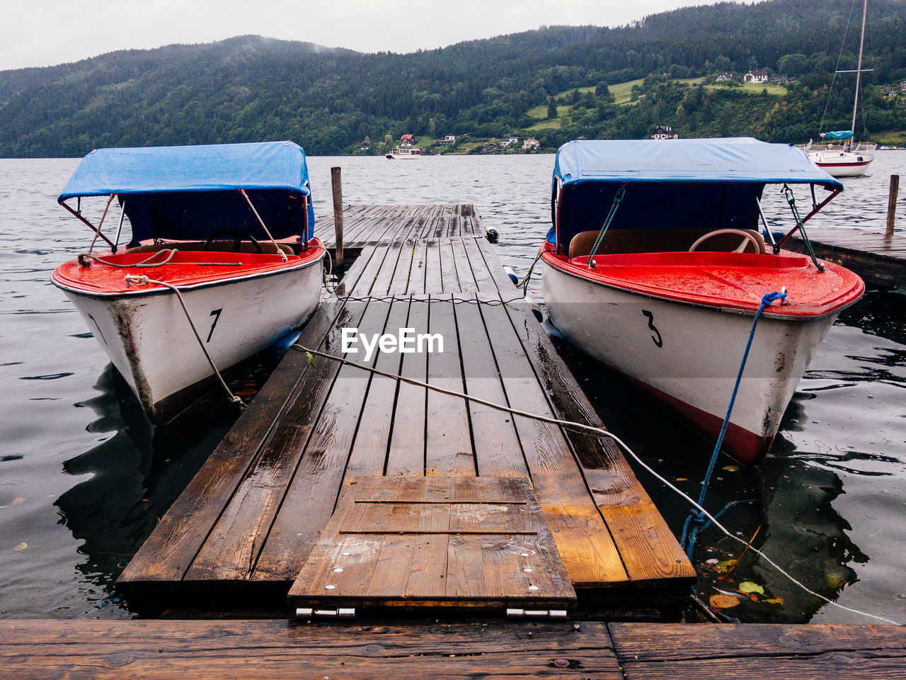 BOAT MOORED ON LAKE