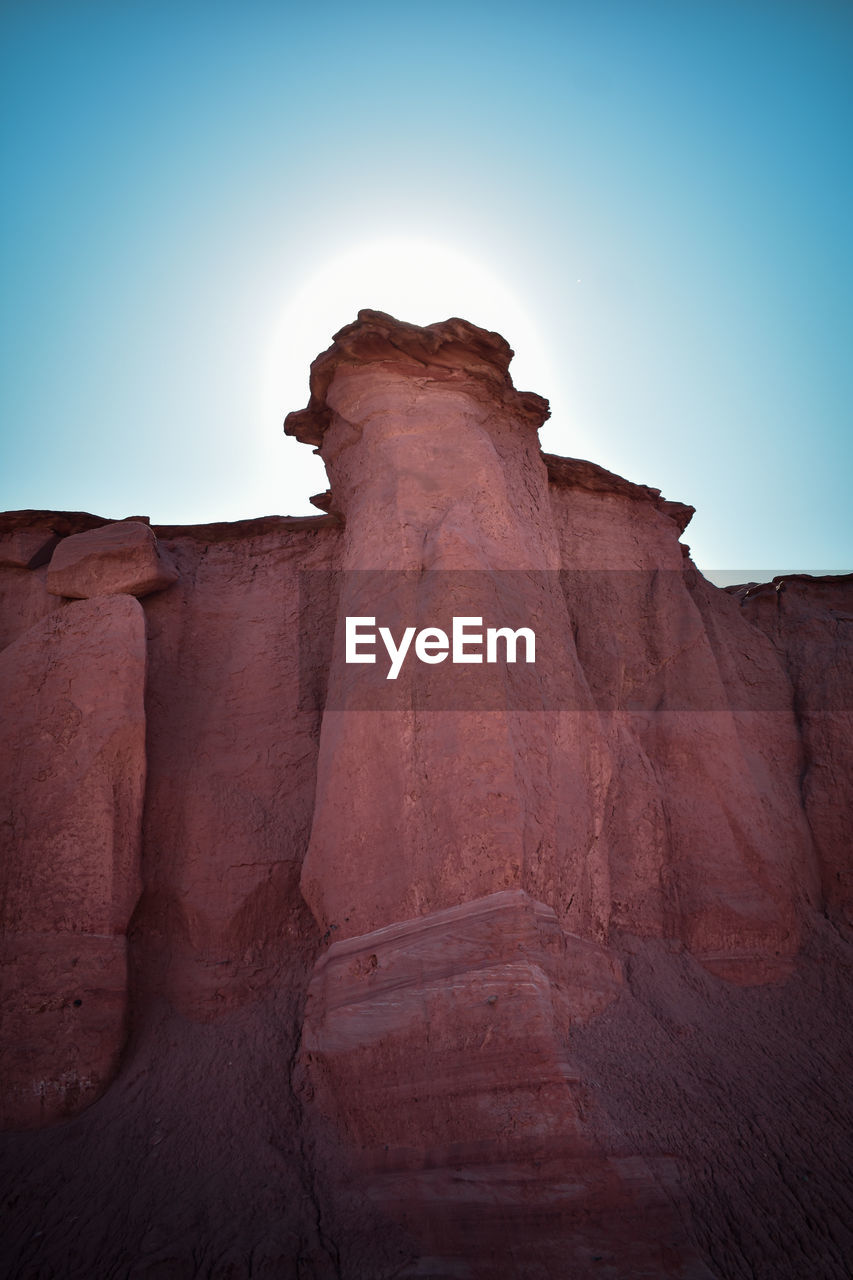 LOW ANGLE VIEW OF ROCK FORMATION