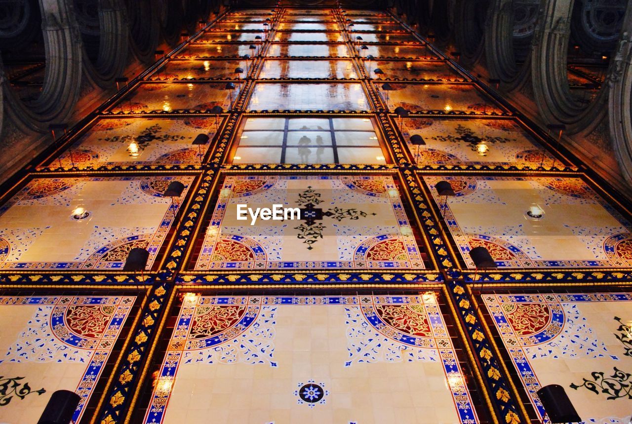 LOW ANGLE VIEW OF ILLUMINATED BUILDING