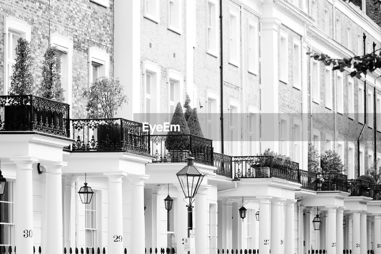 architecture, building exterior, built structure, black and white, building, monochrome photography, city, white, house, facade, monochrome, street, road, no people, window, day, residential district, outdoors, metropolis, urban area, nature