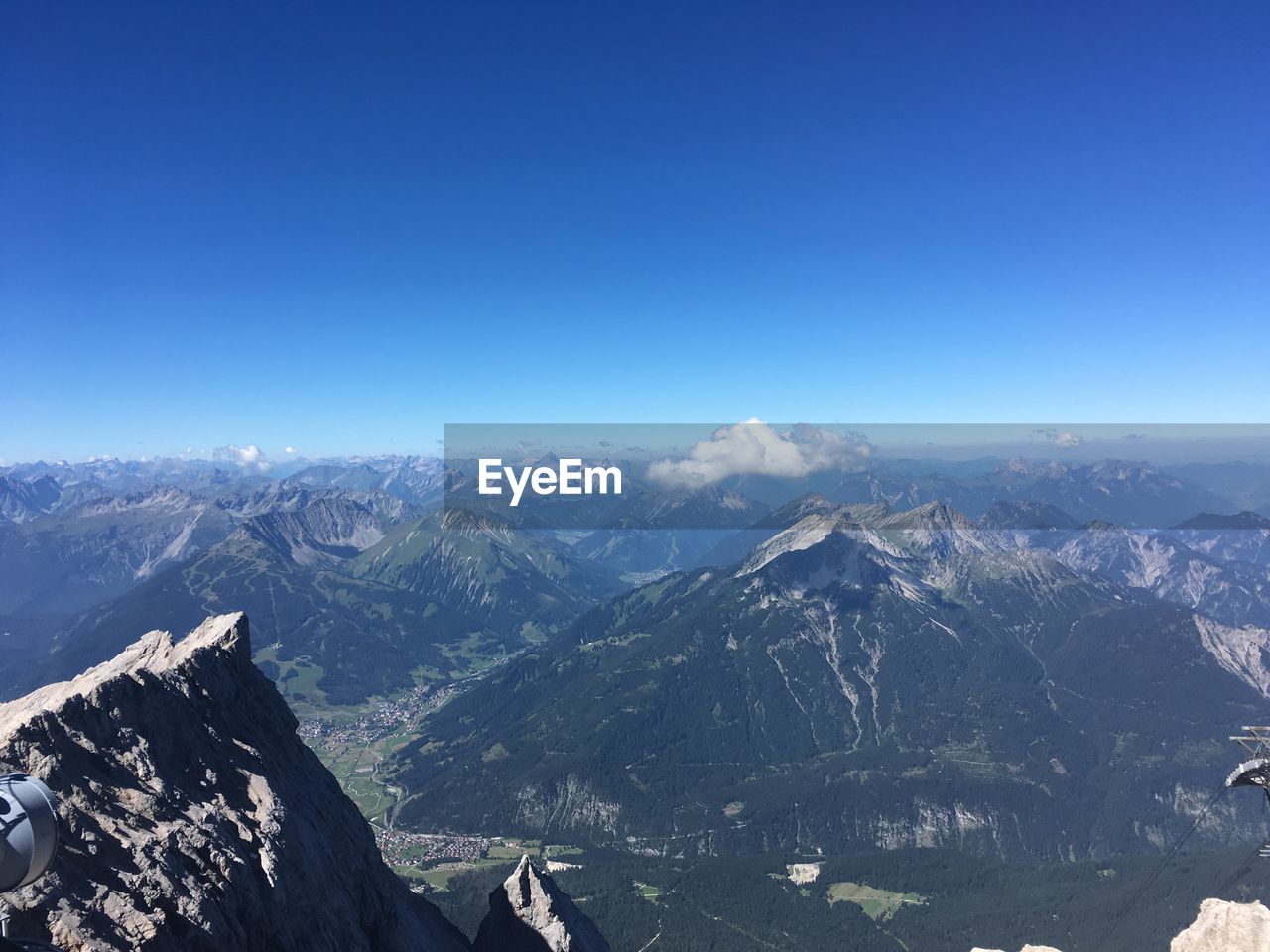 SCENIC VIEW OF MOUNTAINS AGAINST BLUE SKY