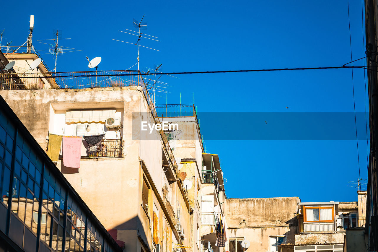 Low angle view of residential buildings against clear sky