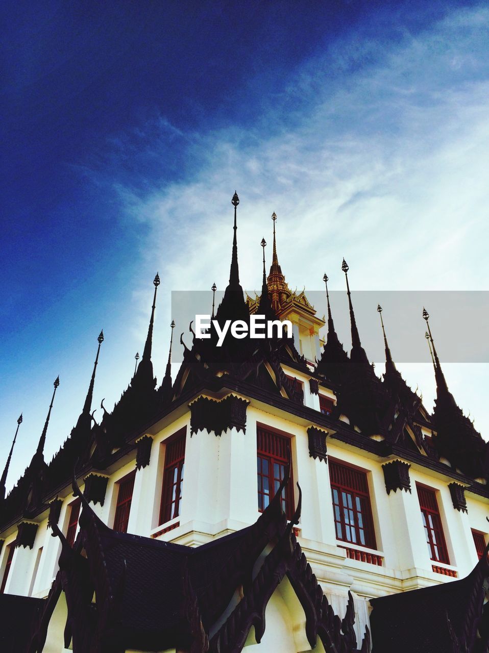 Low angle view of wat ratchanatdaram against sky