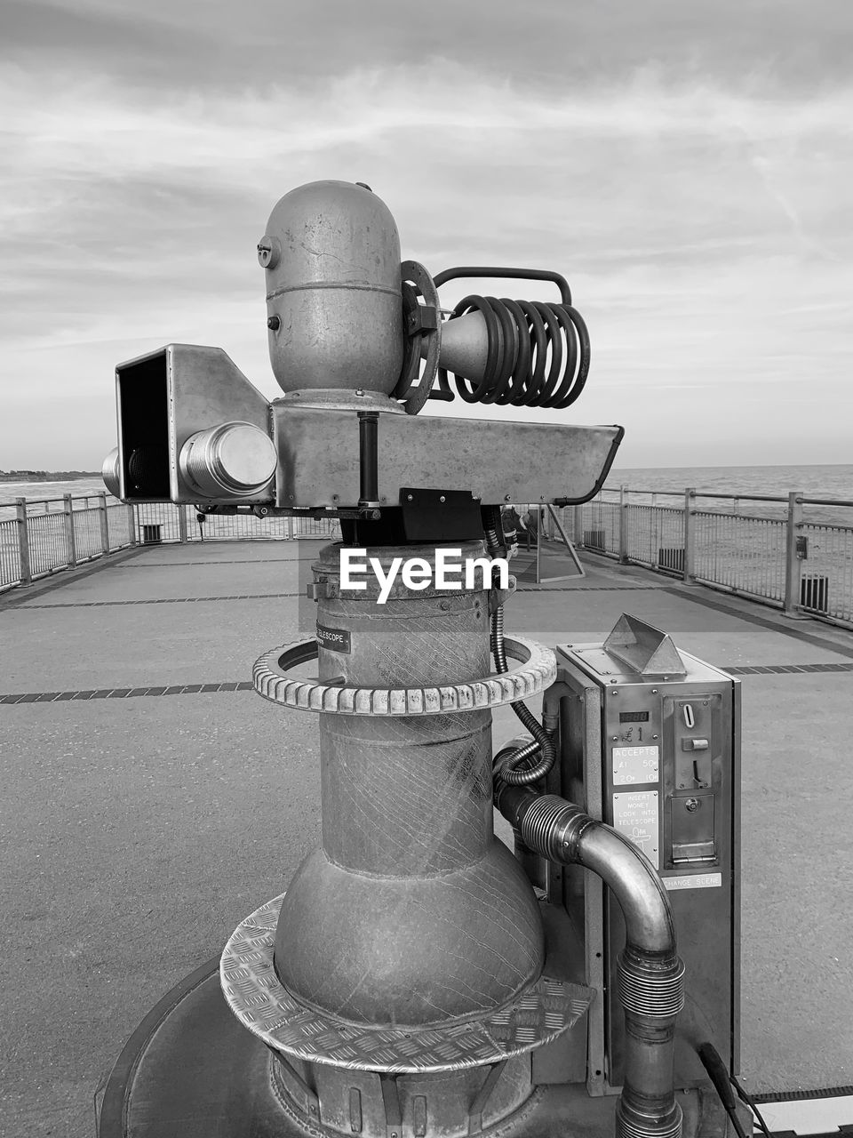 CLOSE-UP OF COIN-OPERATED BINOCULARS ON BEACH