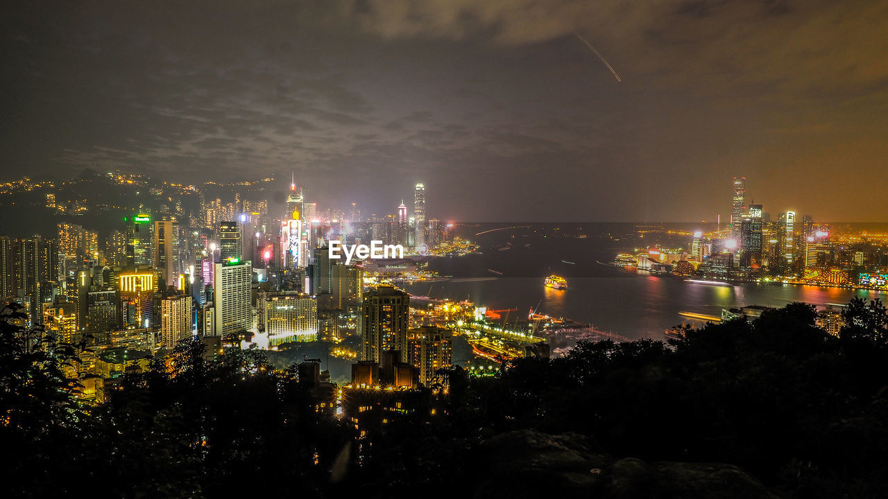 High angle view of illuminated city buildings at night