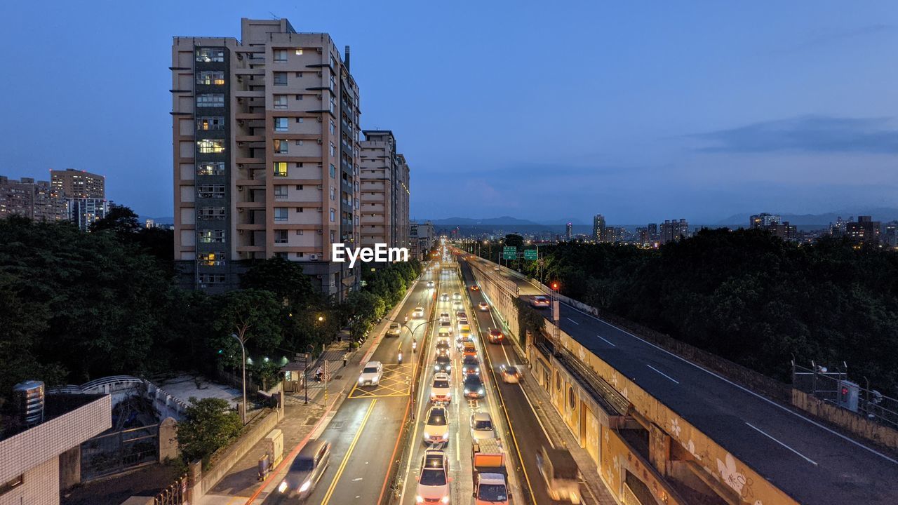 High angle view of light trails on road in city