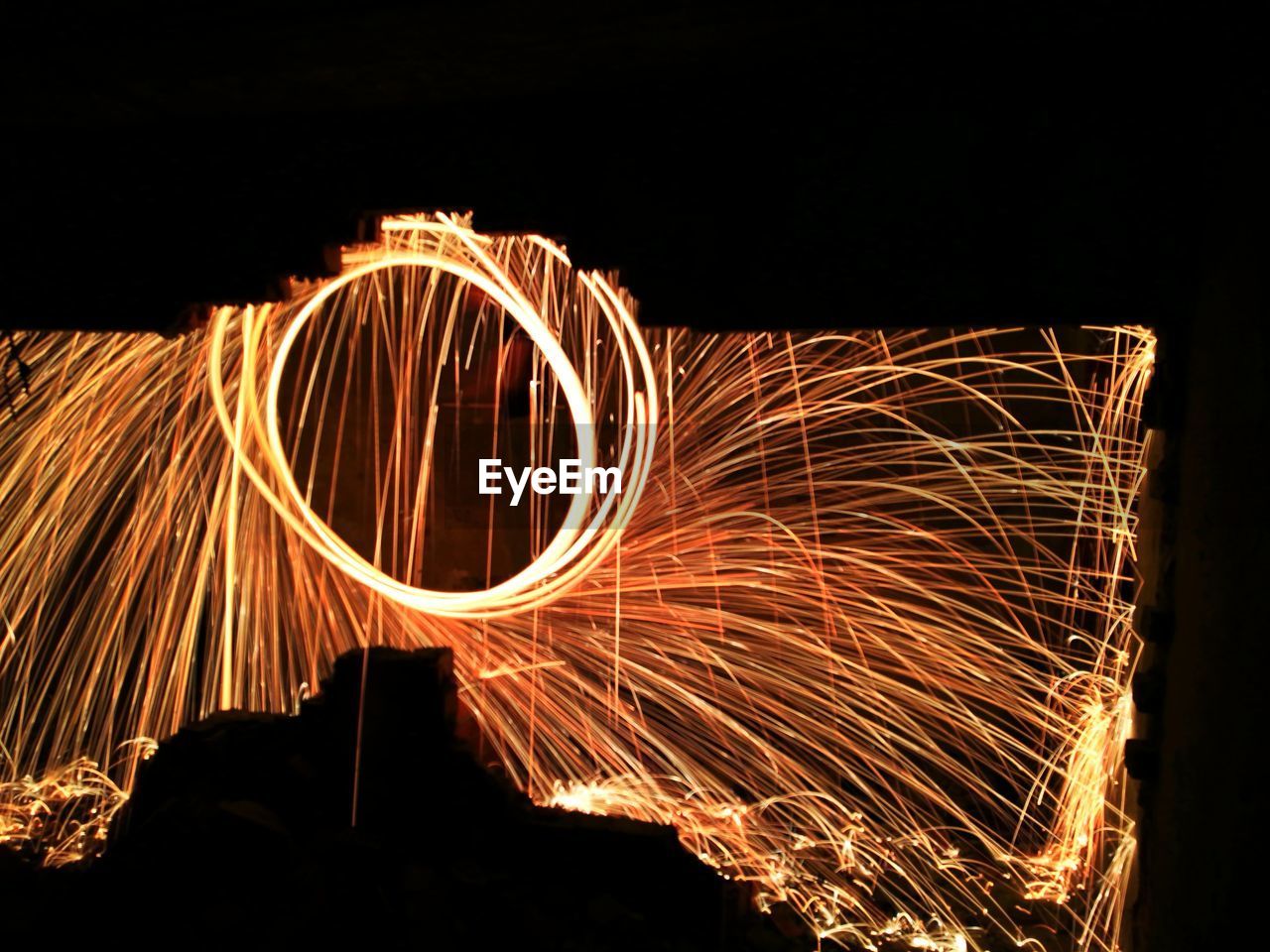 Light trails against sky at night